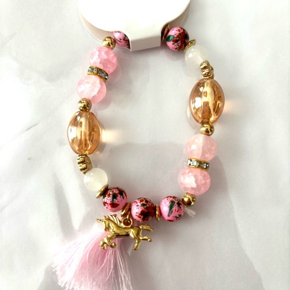 Chloe Accessory Jewelry - Bracelet unicorn tassel pink and golden NWT Fits up to 8 inch wrist